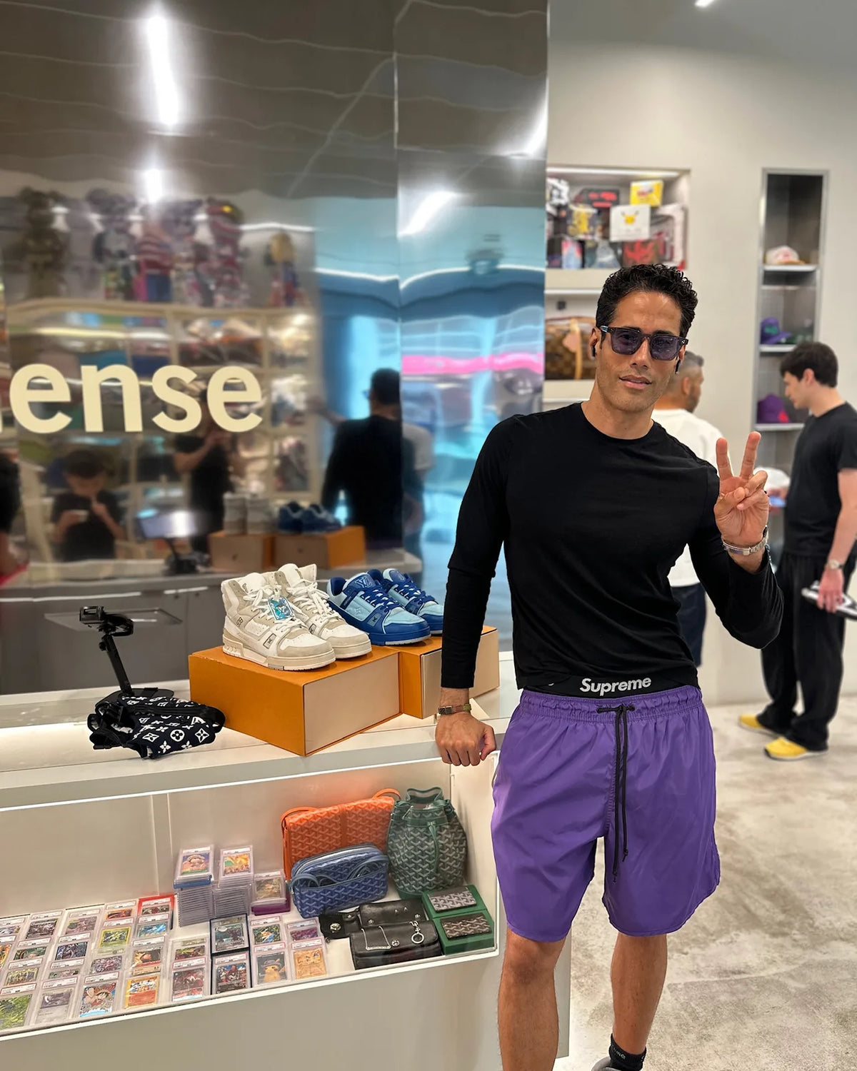 Customer beside the Louis Vuitton sneaker display at Immense Galerie Royalmount